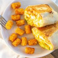 Coastin Burrito · cheesy scrambled eggs + avocado + fries + seasoned cream, served w/ tater tots. Vegetarian.