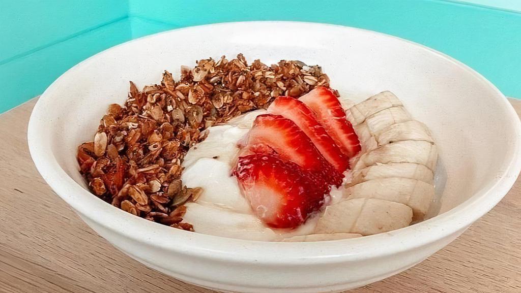 House-Made Granola Bowl · yogurt topped w/ in-season fruit + chia-sunflower seed granola + honey drizzle. Vegetarian.