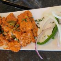 Apollo Fish ** · Crispy fried fish tossed in a yogurt sauce with green chillies and curry leaves.