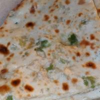 Jalapeño Cheese Naan · Traditional white flour bread topped with jalapeño and Mozzarella cheese, baked in tandoor.