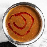 Dal Makhani · Gluten free. Black lentils simmered with tomato and butter with hint of spice.