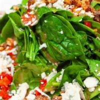 Baby Spinach · Vegetarian. Fresh spinach leaves with gorgonzola, pecans, roasted red peppers, and pomegrana...