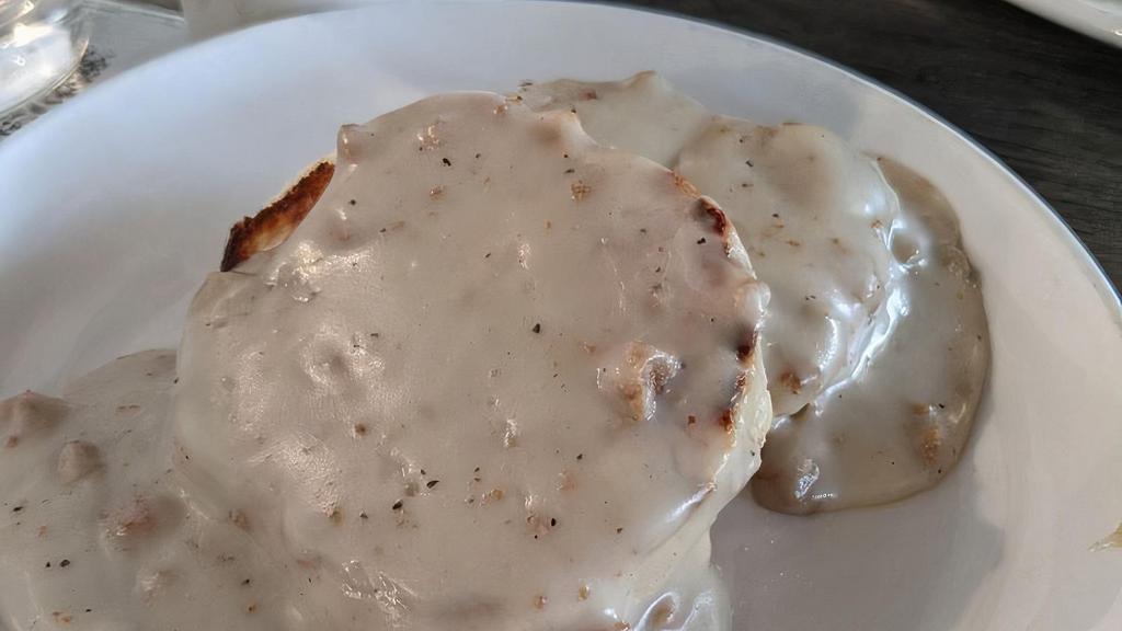 *Biscuits & Gravy · Two homemade biscuits topped with sausage gravy and two eggs any style. Sorry no choice of sides with this dish