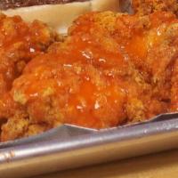 Chicken Bites · 10 Chicken Bites tossed in sauce of your choice