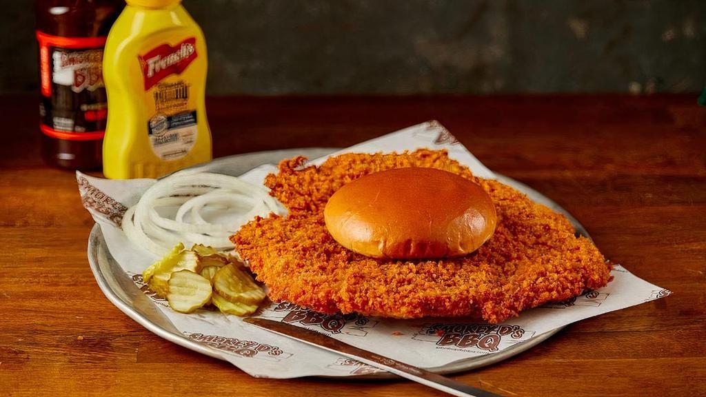 Breaded Pork Tenderloin · Our Signature Breaded Tenderloin served on a Brioche Bun with pickles and onions on the side.
