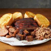 Bbq Sampler · Your choice of 3 BBQ meats served with a half rack of ribs and 4 slices of garlic bread.  Fe...
