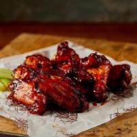 Smoked Wings · One pound of Smoked Wings sauced in your choice of Asian Glaze, BBQ Glaze, or Buffalo Sauce.