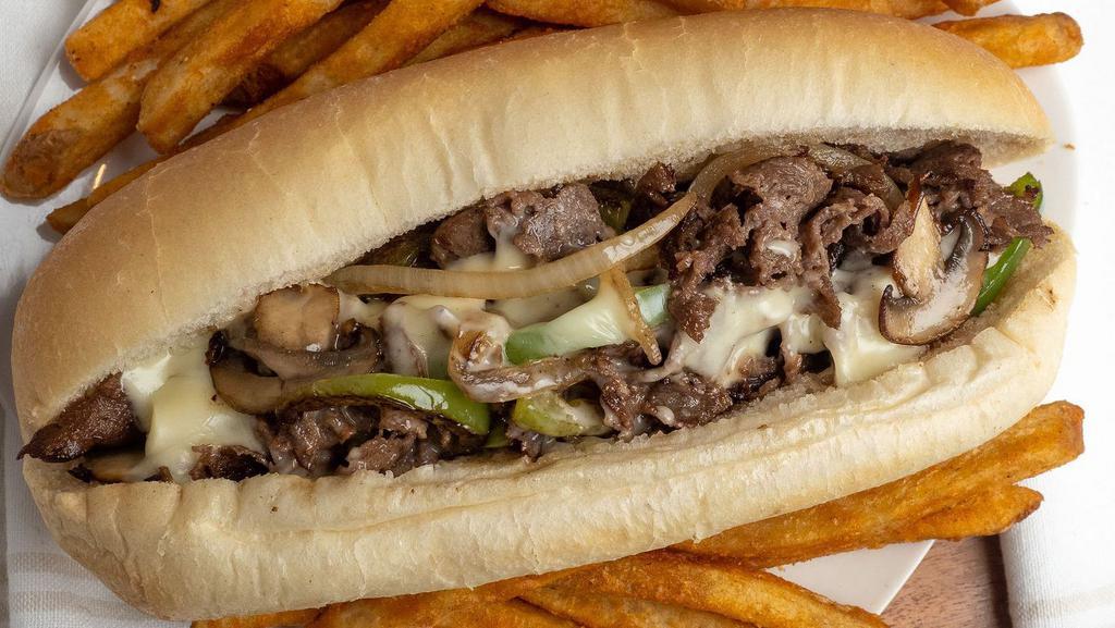 Classic Philly · Shredded steak or chicken, grilled green peppers, mushrooms, onions, cooked with our Cal`s mushroom signature sauce, and toped with melted American cheese. 

** Fries not included with the price