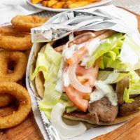 Gyro Sandwich · Gyro meat, lettuce, tomatoes, onions, wrapped in a warm fluffy pita with side of our homemad...