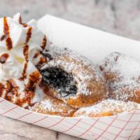 Deep Fried Oreos · Five double stuffed cookies made in our funnel cake batter, drizzled with chocolate and topp...