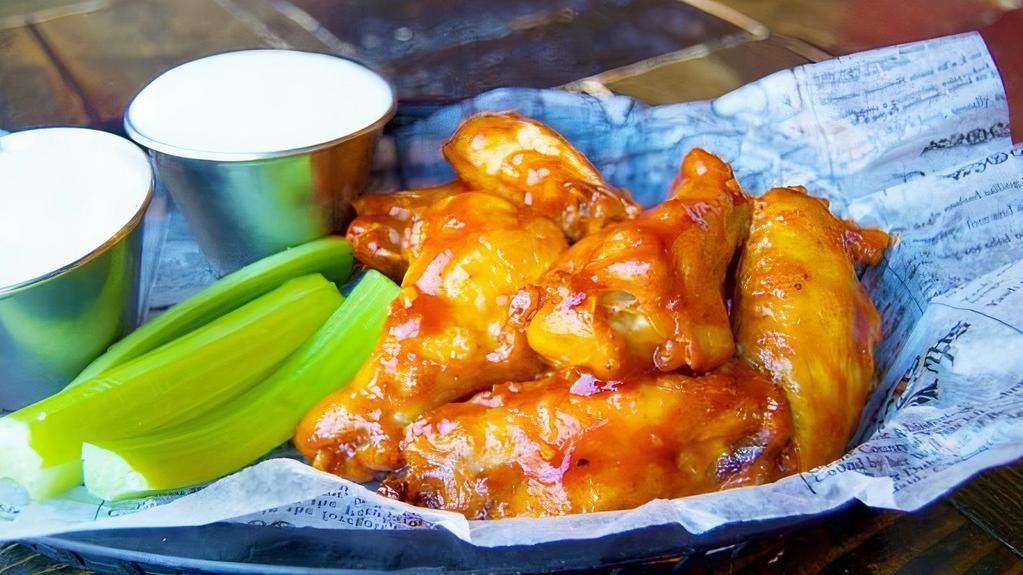 Boneless Wings · 10oz of succulent, breaded chicken fillets, tossed in one of our housemade wing sauces, served with a side of ranch or blue cheese