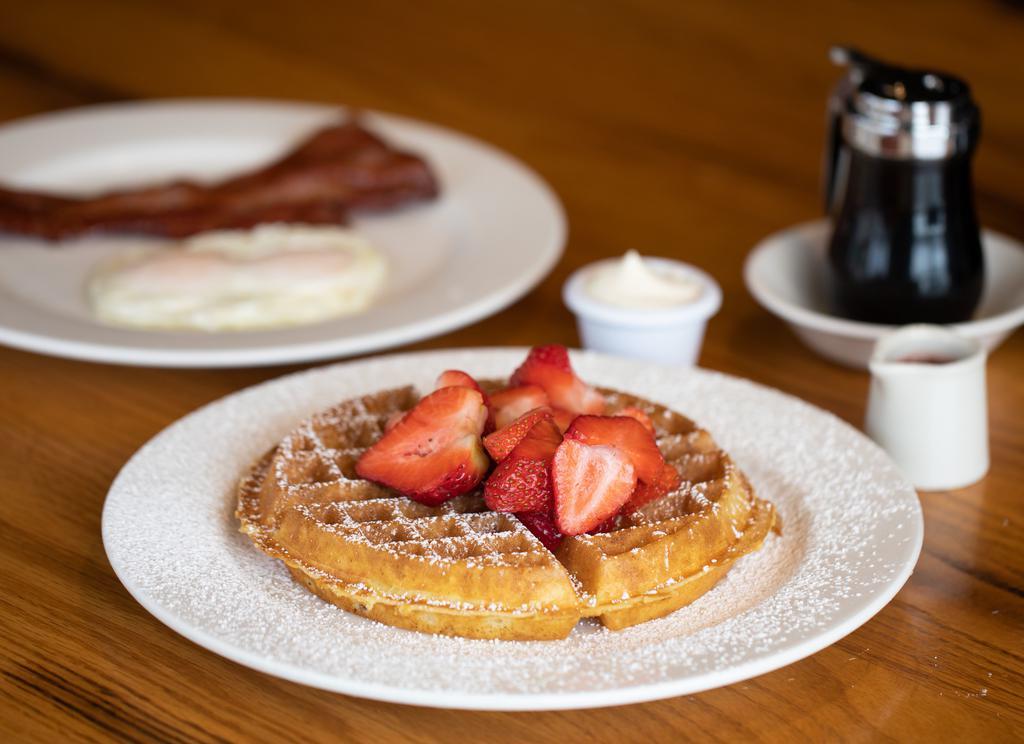 Michelle'S Waffle Dream · Our golden-brown Belgian waffle served with whipped butter plus two eggs any style and your choice of two pieces of Daily’s bacon or two link sausages or one sausage patty. 700 - 805 cal.