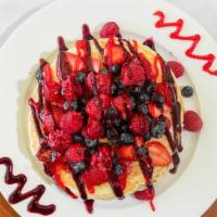 Berry Pancakes · With strawberries, blueberries, and raspberries. Topped with blueberry and strawberry glaze....