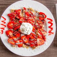 Nutella Crêpe · Choice of fruit. Dusted with powdered sugar and topped with whipped cream.