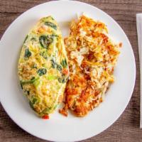 Garden Omelet · Tomatoes, mushrooms, onions, green pepper, and spinach. Served with potatoes or fruit and yo...