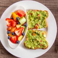 Avocado Toast · Served on multigrain toast topped with homemade guacamole and two eggs on top. With a choice...