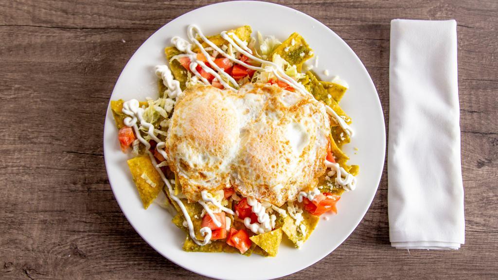 Chilaquiles Verdes O Rojos · Corn tortillas chips dipped in our homemade green salsa topped with Pepper Jack cheese, sour cream on the side, served with two eggs any style and your choice of fruit or potato.
