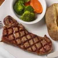 New York Strip Steak · 12 oz angus new York broiled to perfection, topped with parsley garlic butter. America's fav...