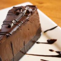 Death By Chocolate · Rich, flourless chocolate cake with layer of chocolate mousse and topped with dark chocolate...