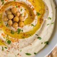Hummus · Hummus is pureed chickpeas blended with olive oil, lemon juice, tahini and garlic.
