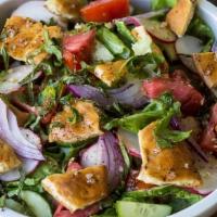 Fatoosh · Fattoush is toasted or fried pieces of khubz (bread) combined with mixed greens and other ve...