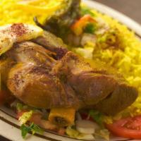 Quzi With Rice · Quzi is lamb shanks with yellow rice.