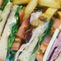 Supreme Club · Tender slices of ham and turkey stacked club-style with bacon, swiss cheese, lettuce, tomato...