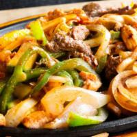 Vegetarian Fajitas · A light combination of fresh mushrooms, yellow squash, bell peppers, onions, and tomatoes.