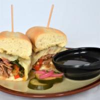 Brisket Cheesesteak. · Chopped brisket, gouda schmear, melted provolone, caramelized onions, peppers, hoagie, XO di...