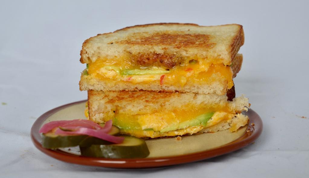Grilled Pimento Cheese · Fried green tomato, avocado, melted Tillamook cheddar, homemade pimento cheese, toasted sourdough.