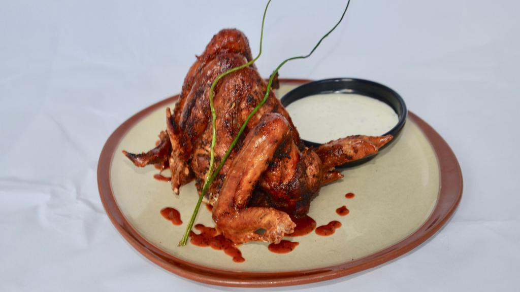 Jumbo Smoked Chicken Wings · Coffee-brined whole wings, spicy BBQ, buttermilk dressing.