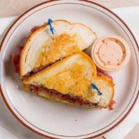 Corned Beef · With swiss cheese, pickles, and mustard on an onion roll or grilled rye.