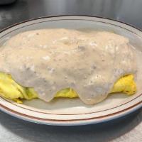Southern Omelette · Four eggs with sausage, onions, cheese, and hash browns inside, topped with sausage gravy.