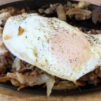 Philly Skillet · Steak, onions, green peppers, hash browns, swiss cheese two eggs, and toast.