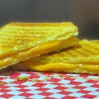 Grilled Cheese Sandwich · Cheddar cheese melted between two slices of texas toast
