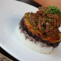 Pabellon Dish · Shredded beef, shredded chicken, or Stewed fish served with white rice, black beans, and swe...