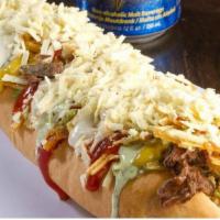 Pepito Beef · White bread stuffed with beef, col, corn, potato sticks, cheese, and sauces.