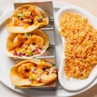 Shrimp Tacos · Jumbo shrimp on corn or flour tortillas topped with spicy-sweet coleslaw and chipotle sauce.