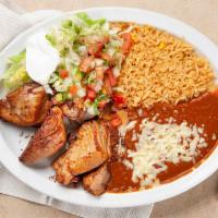Carnitas · Perfectly seasoned slow roasted pork tips served with Mexican rice, refried beans, lettuce, ...