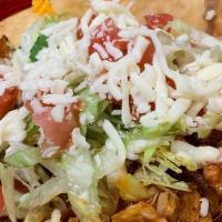 Huarache · Like a Mexican flatbread pizza. Made with choice of meat, beans, lettuce, cheese.