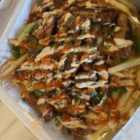 Blackened Chicken Fries · Garlic fries topped w/ Cheddar Jack, blackened chicken meat, fried onions, green onions, bac...