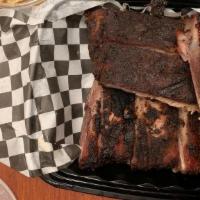 Smoked St. Louis Ribs · Rubbed with our signature spices and slow smoked. Served with your choice of two sides. Uncl...