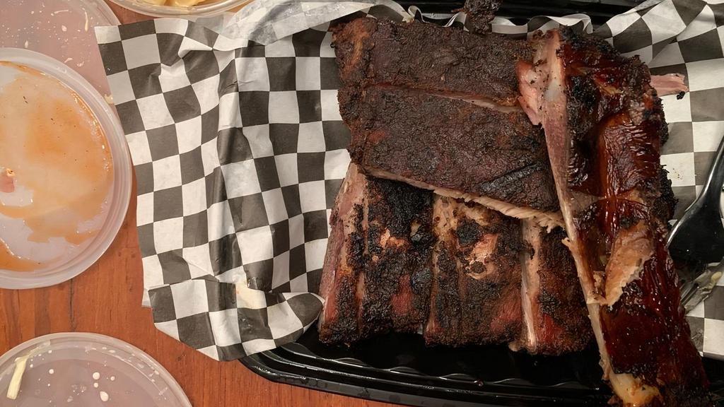 Smoked St. Louis Ribs · Rubbed with our signature spices and slow smoked. Served with your choice of two sides. Uncle Bubby's BBQ sauce or mango habanero glaze