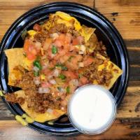 Small Loaded Nachos · Chips, nacho cheese, meat, pico, sour cream & salsa on the side
