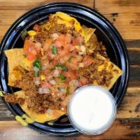 Large Loaded Nachos · Chips, nacho cheese, meat, pico, sour cream & salsa on the side