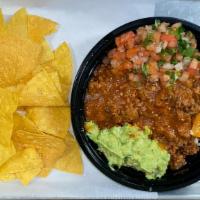 Loaded Bowl · Rice, beans, cheese, meat, pico, guac, salsa, lime, small chips.