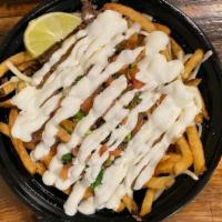 Large Loaded Fries · fries, cheese, meat of your choice, salsa, pico, sour cream, lime