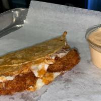 Shrimp Corn Quesadilla · 2 breaded shrimp with melted cheese inside a grilled corn tortilla, (chipotle sour cream & l...