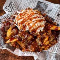 Brisket Wedges · Fried Potato Wedges Loaded with Brisket Burnt Ends, Carolina Reaper Cheese, Coleslaw, and BB...