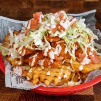 Loaded Cyber Fries · Waffle Fries Loaded with Popcorn Chicken, Buffalo Sauce, Shredded Cheddar Cheese, Lettuce, T...